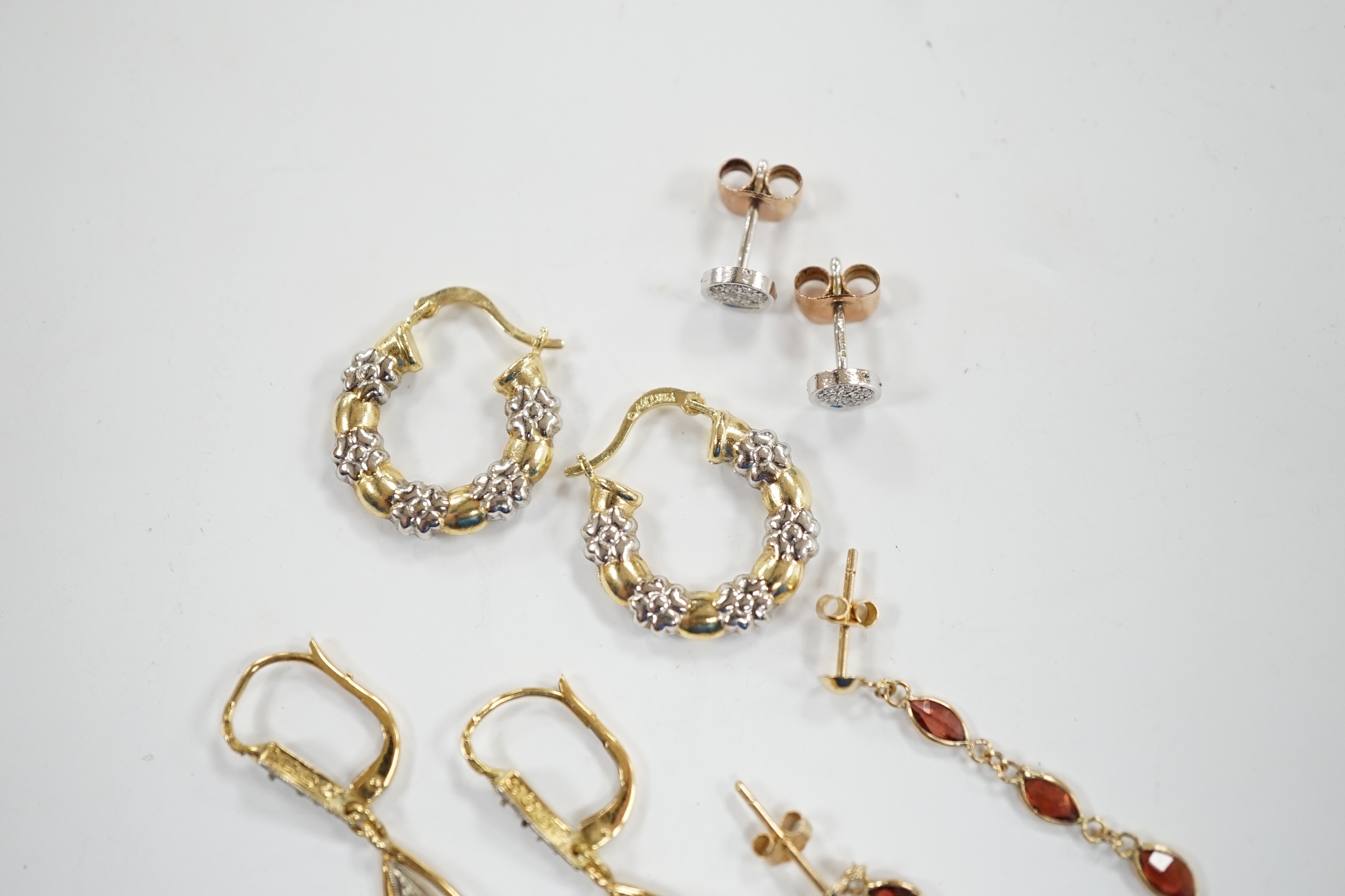 A pair of French 18k and cultured pearl drop earrings, 45mm and three other pairs to include 14k and diamond cluster, 9ct and garnet drop and two colour 10k.